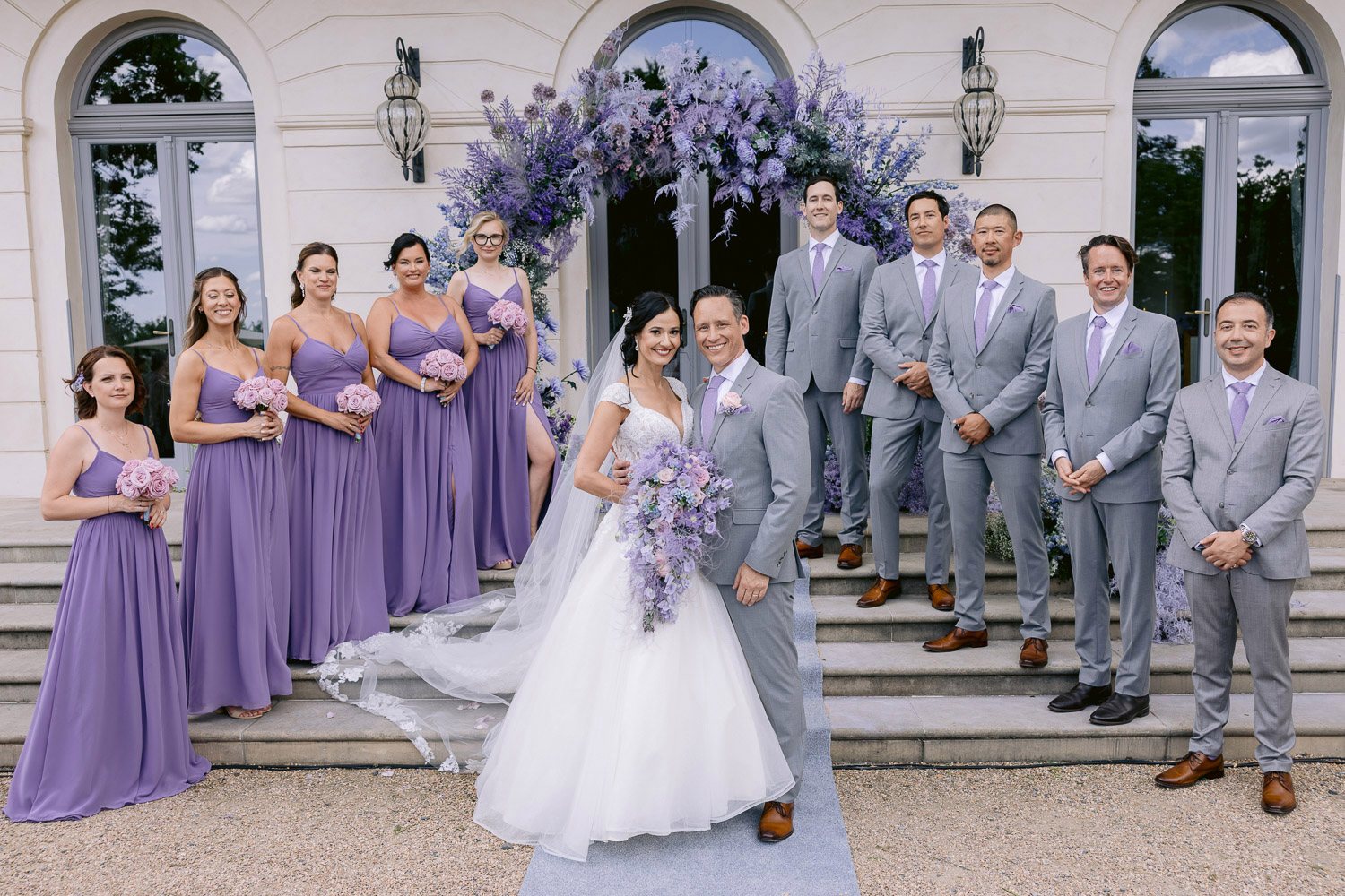 Chateau Mcely Bridal Party Steps Bridal party in lilac and grey on the château steps