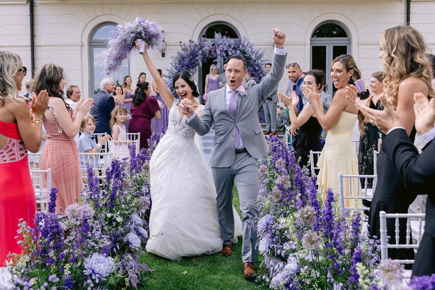Chateau Mcely Ceremony Guests Cheering Guests cheering as the newlyweds walk back up the aisle