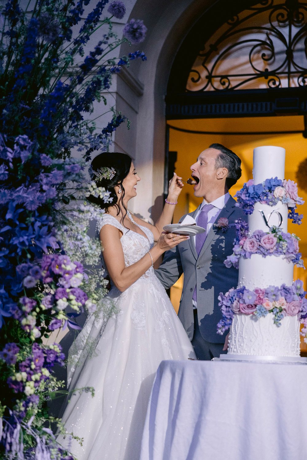 Chateau Mcely Wedding Cake Cutting Bride and groom cutting a lavender wedding cake