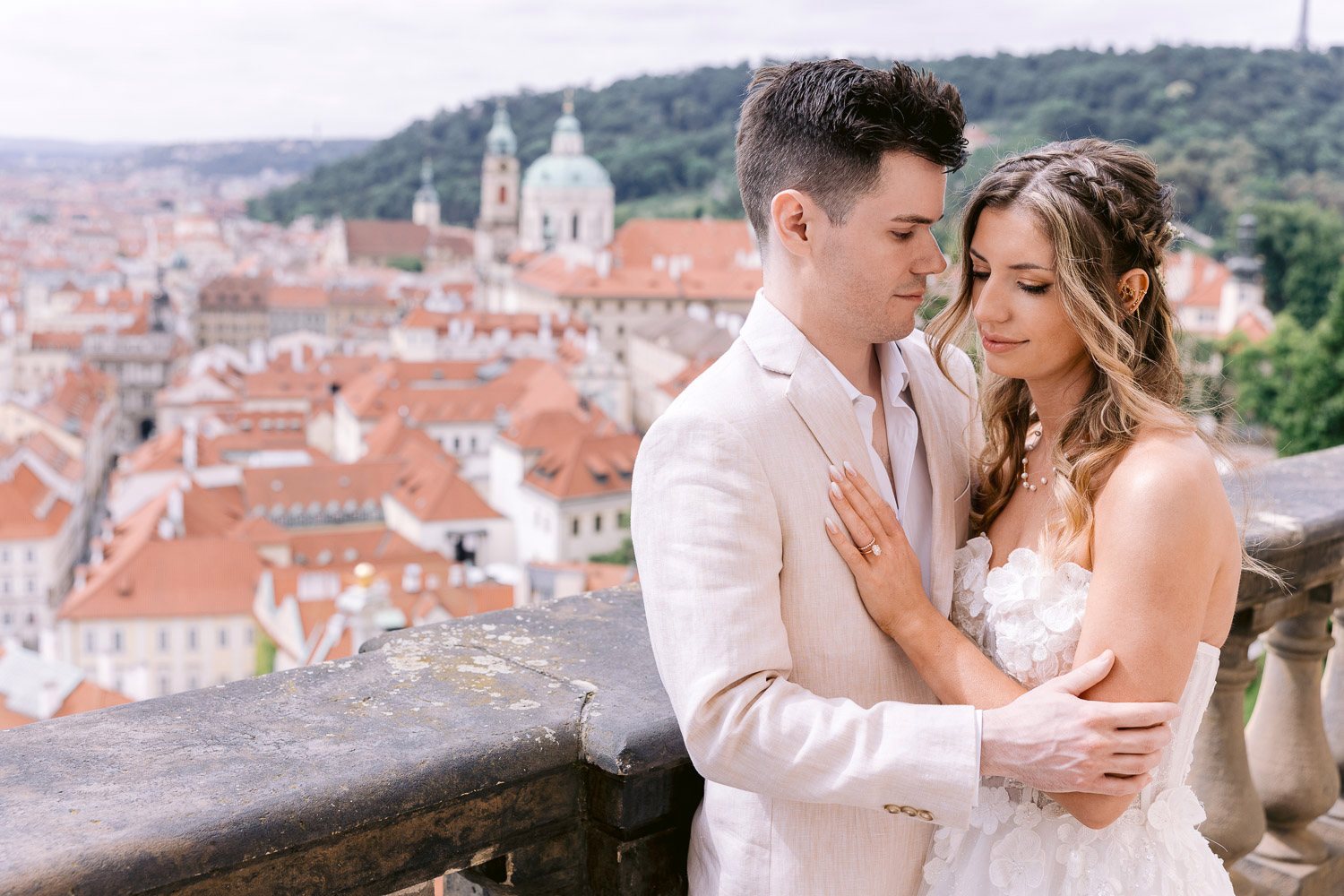 Lobkowicz Palace Elopement Couple Embrace Prague Rooftops Couple embracing above the rooftops of Prague