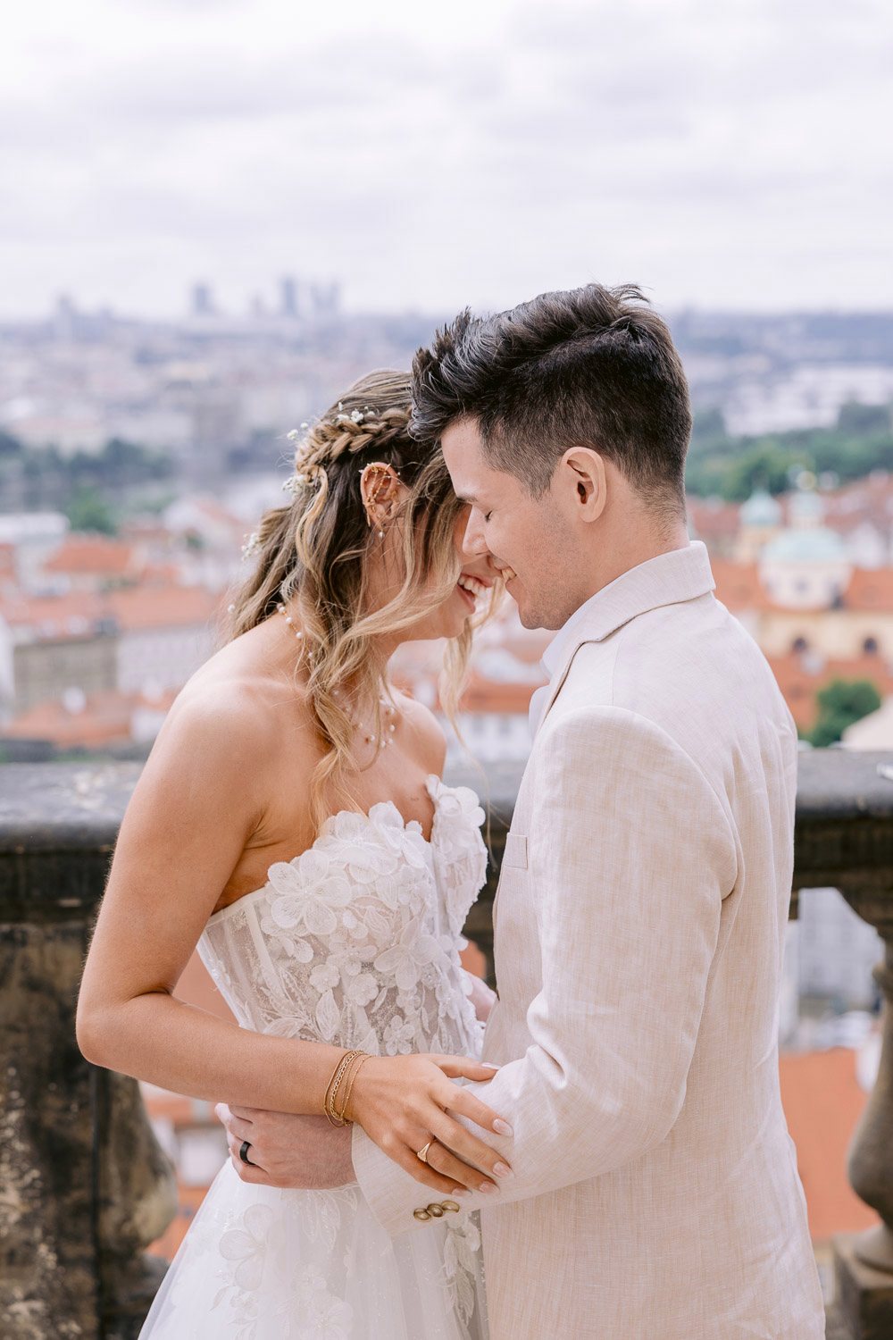 Lobkowicz Palace Elopement Couple Forehead Touch Prague View Newlyweds laughing forehead to forehead above Prague