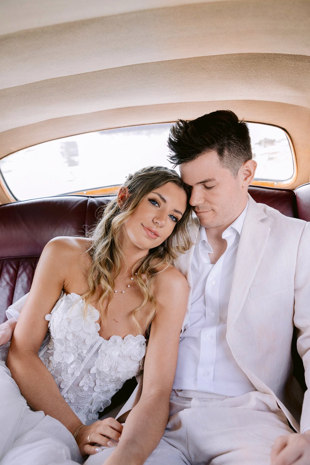 Lobkowicz Palace Elopement Couple Inside Rolls Royce Couple cuddling inside the vintage Rolls-Royce