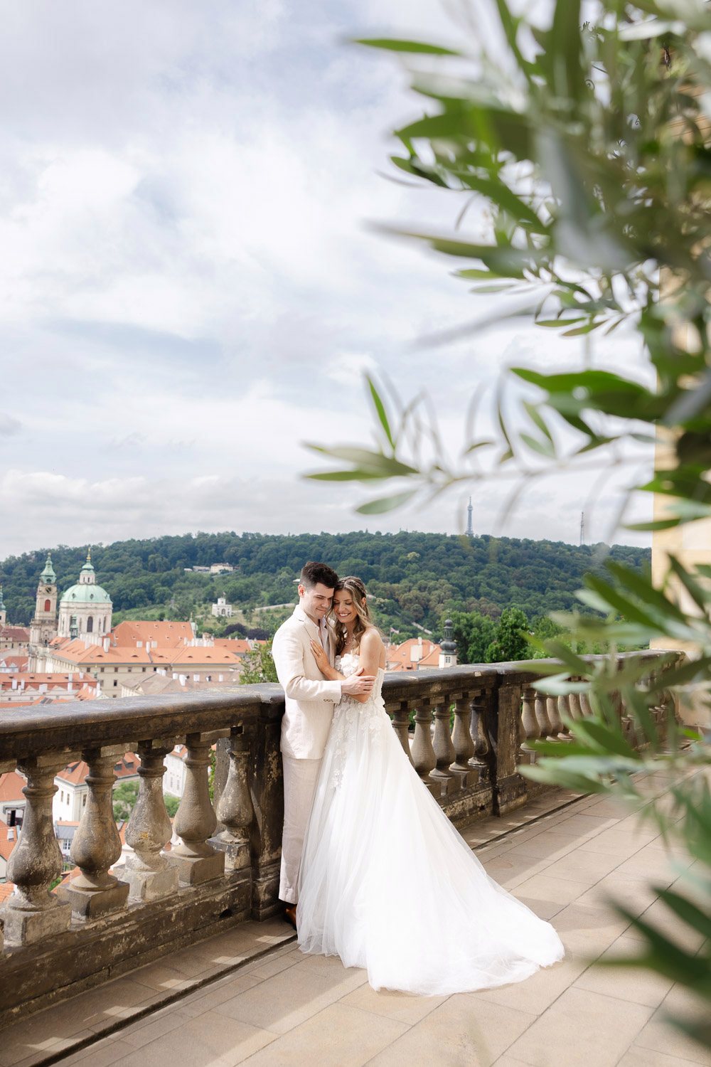 Lobkowicz Palace Elopement Couple Terrace Olive Branches Newlyweds on the terrace framed by olive branches