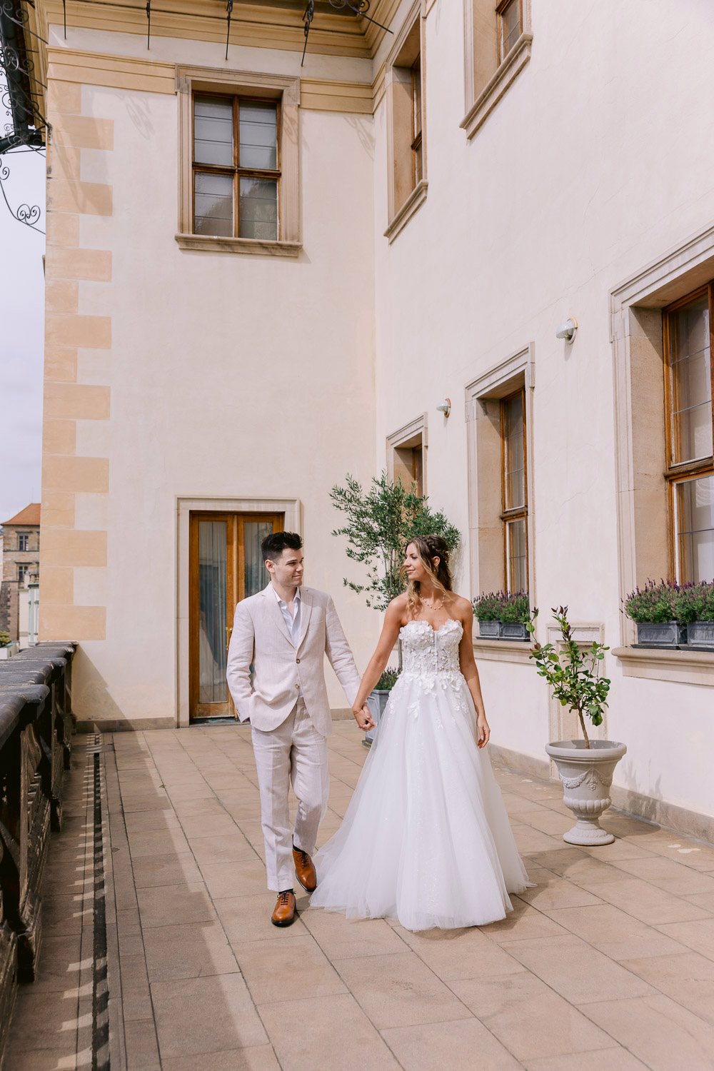 Lobkowicz Palace Elopement Couple Walking Palace Terrace Couple walking along the palace terrace