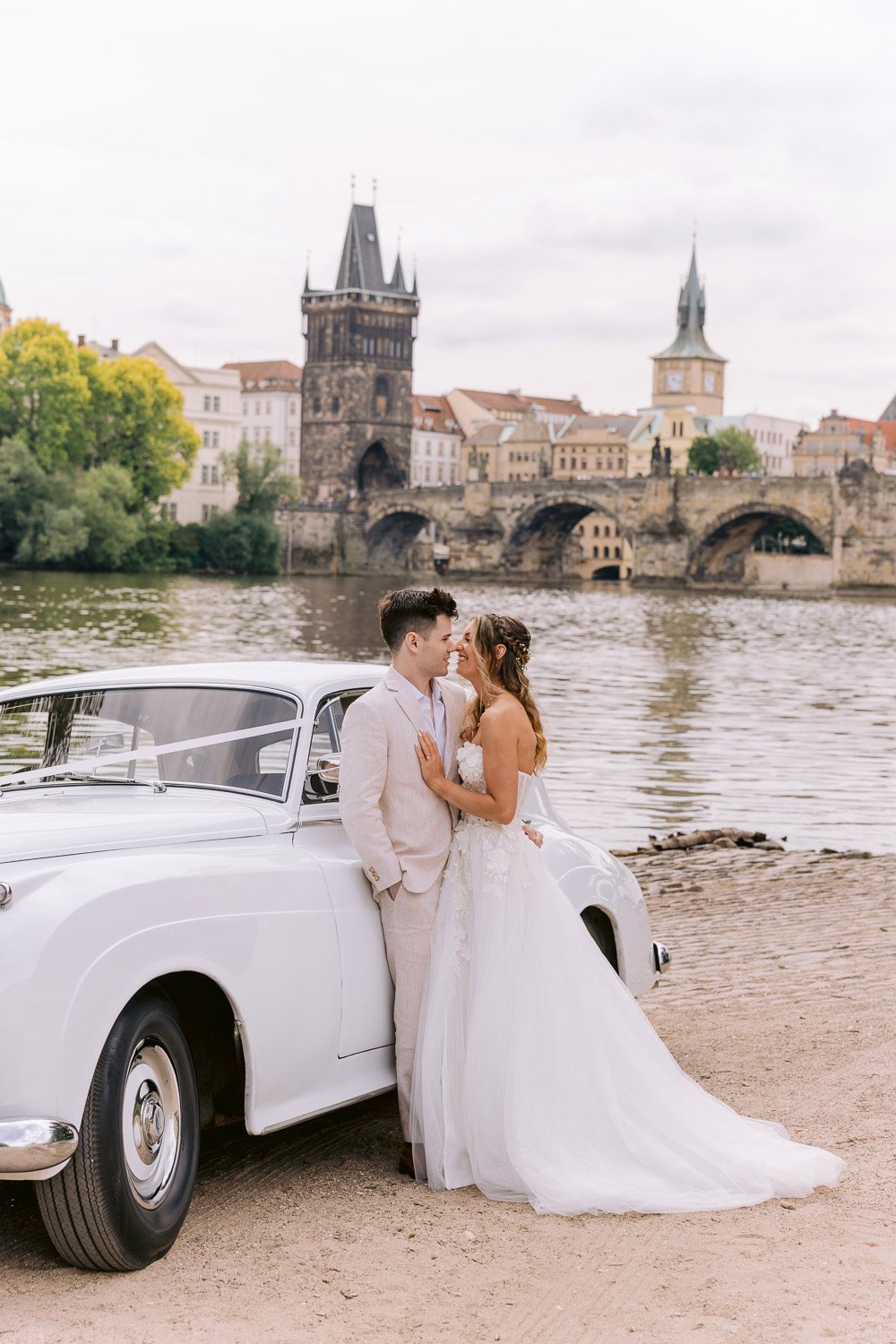 Lobkowicz Palace Elopement Rolls Royce Charles Bridge Couple by the Rolls-Royce with Charles Bridge behind