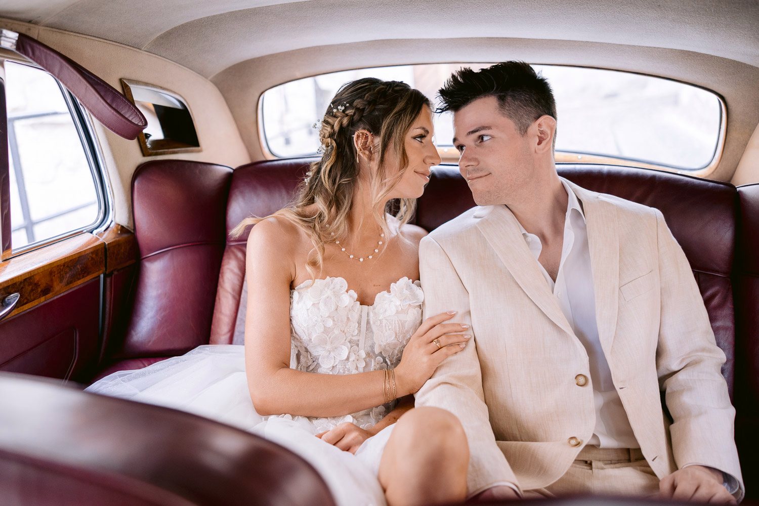 Lobkowicz Palace Elopement Rolls Royce Ride Couple riding in a vintage Rolls-Royce