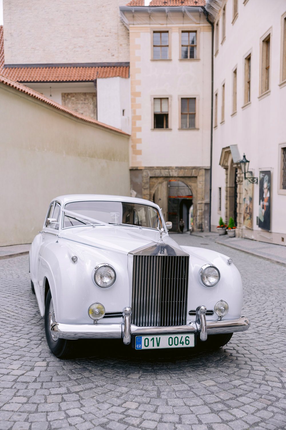 Lobkowicz Palace Elopement Vintage Rolls Royce Castle Lane Vintage Rolls-Royce on a cobbled lane at Prague Castle