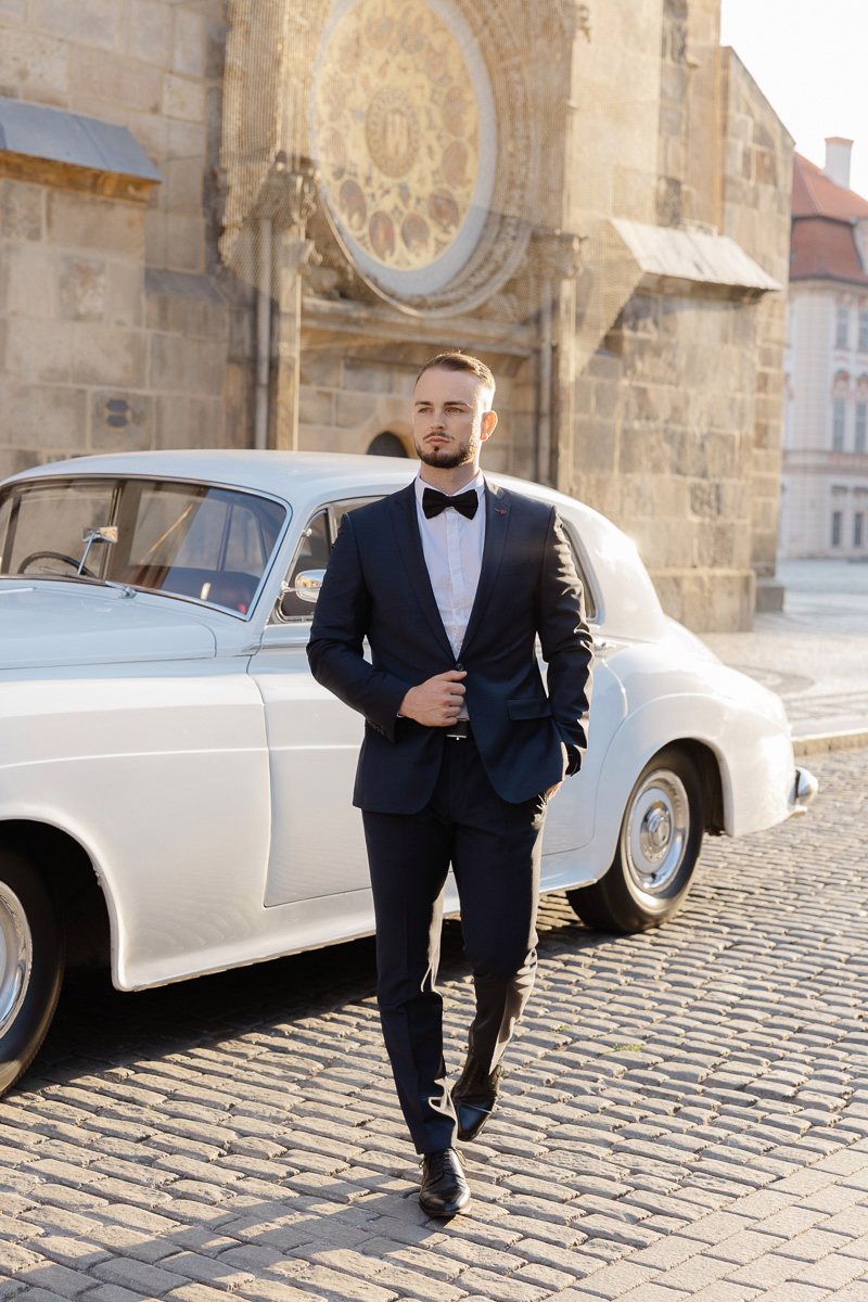 Prague-groom-portrait-old-town Groom portrait by a vintage car in Prague