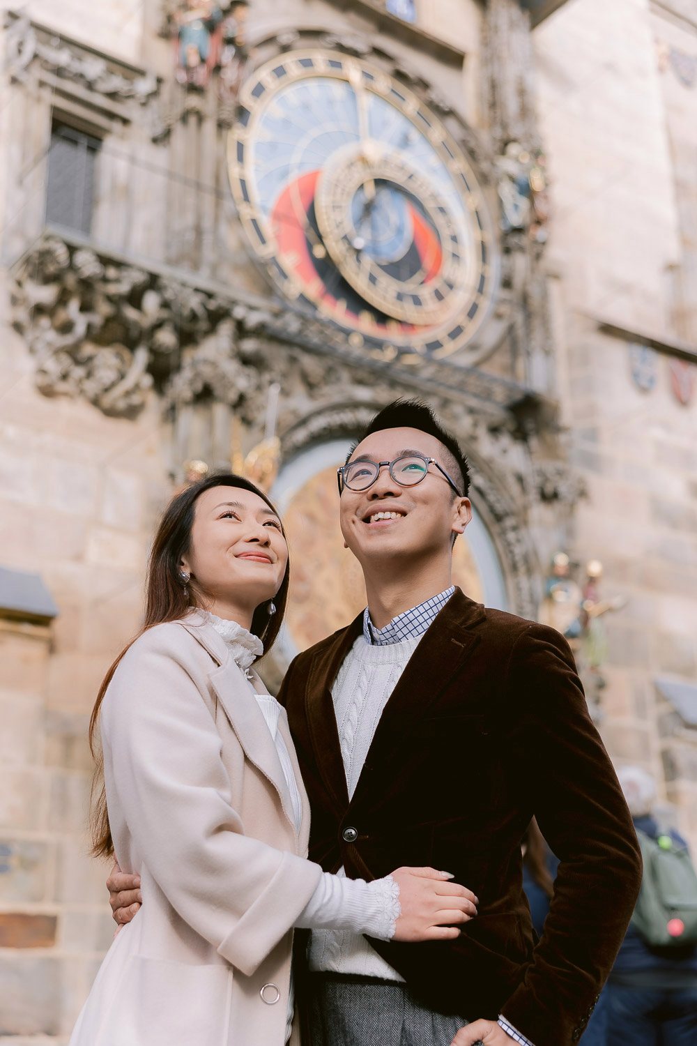 Couple smiling at the Astronomical Clock