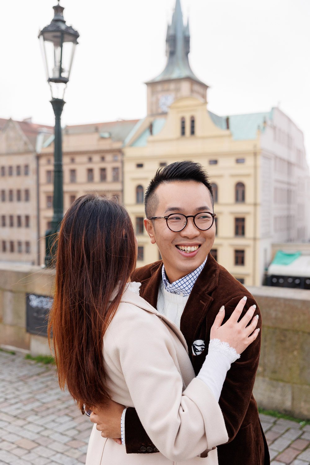 Couple embracing on Charles Bridge