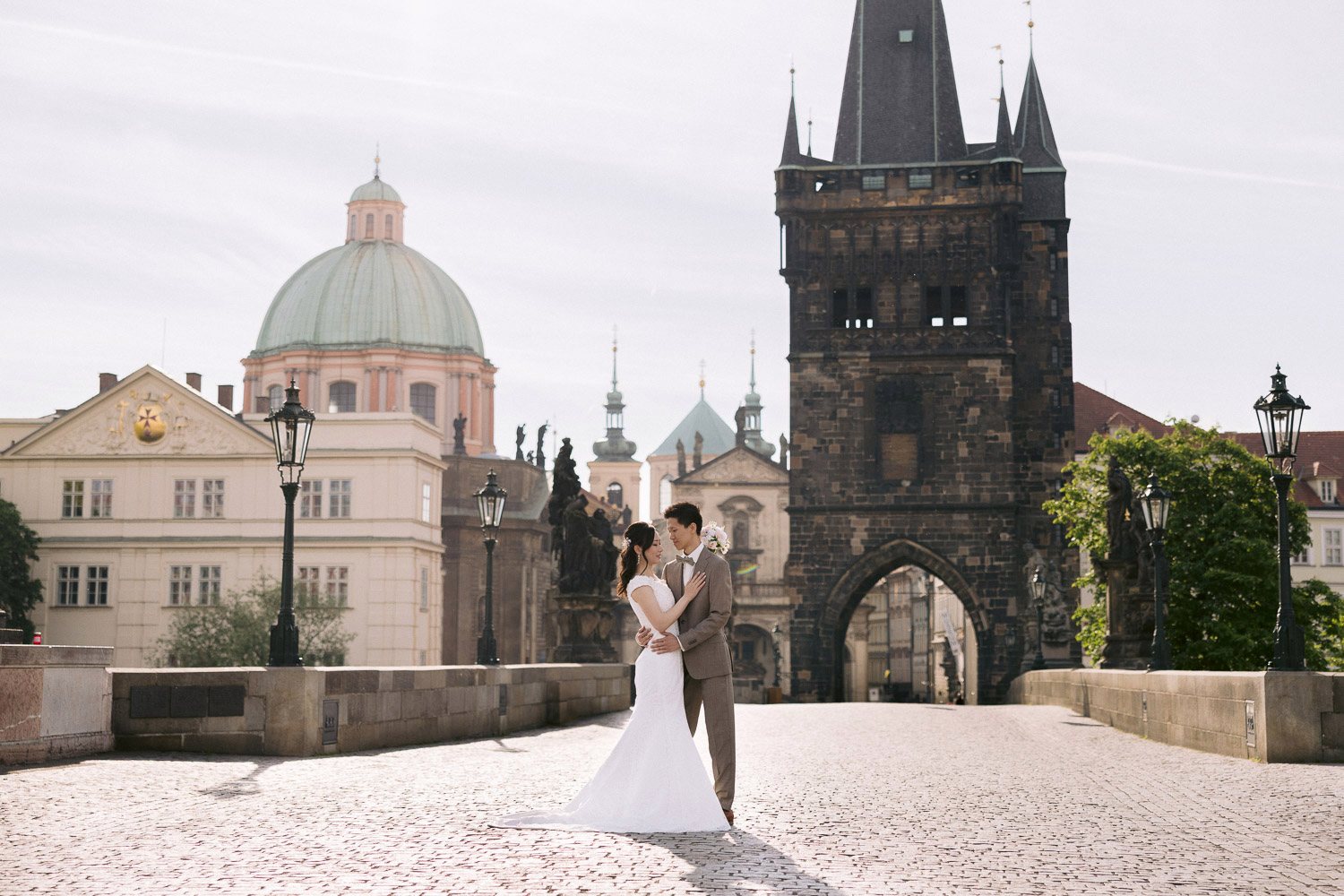 Couple at the Old Town Bridge Tower in the morning