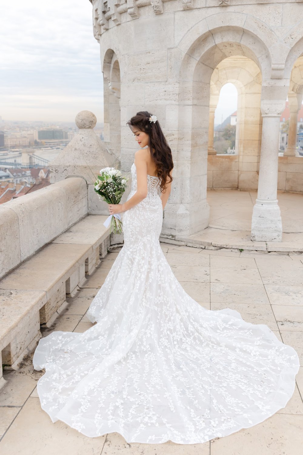 Review Jeanne Budapest Pre Wedding 1 Bride in a lace gown on the terrace of Fisherman's Bastion, Budapest