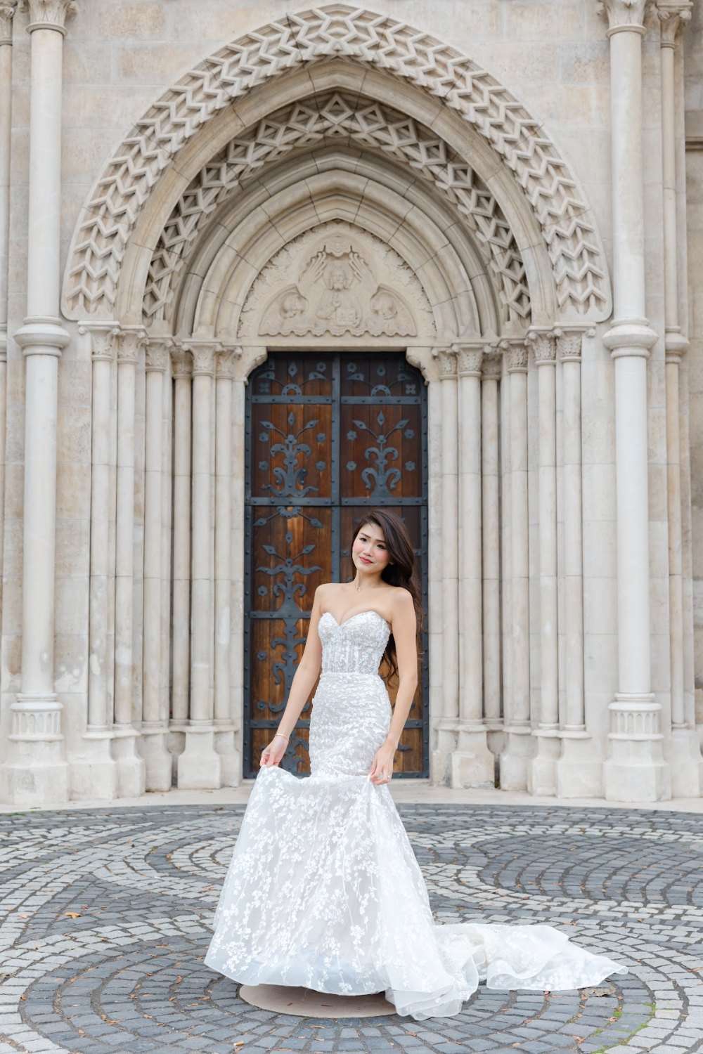 Review Jeanne Budapest Pre Wedding 2 Bride in front of the Gothic portal of Matthias Church, Budapest