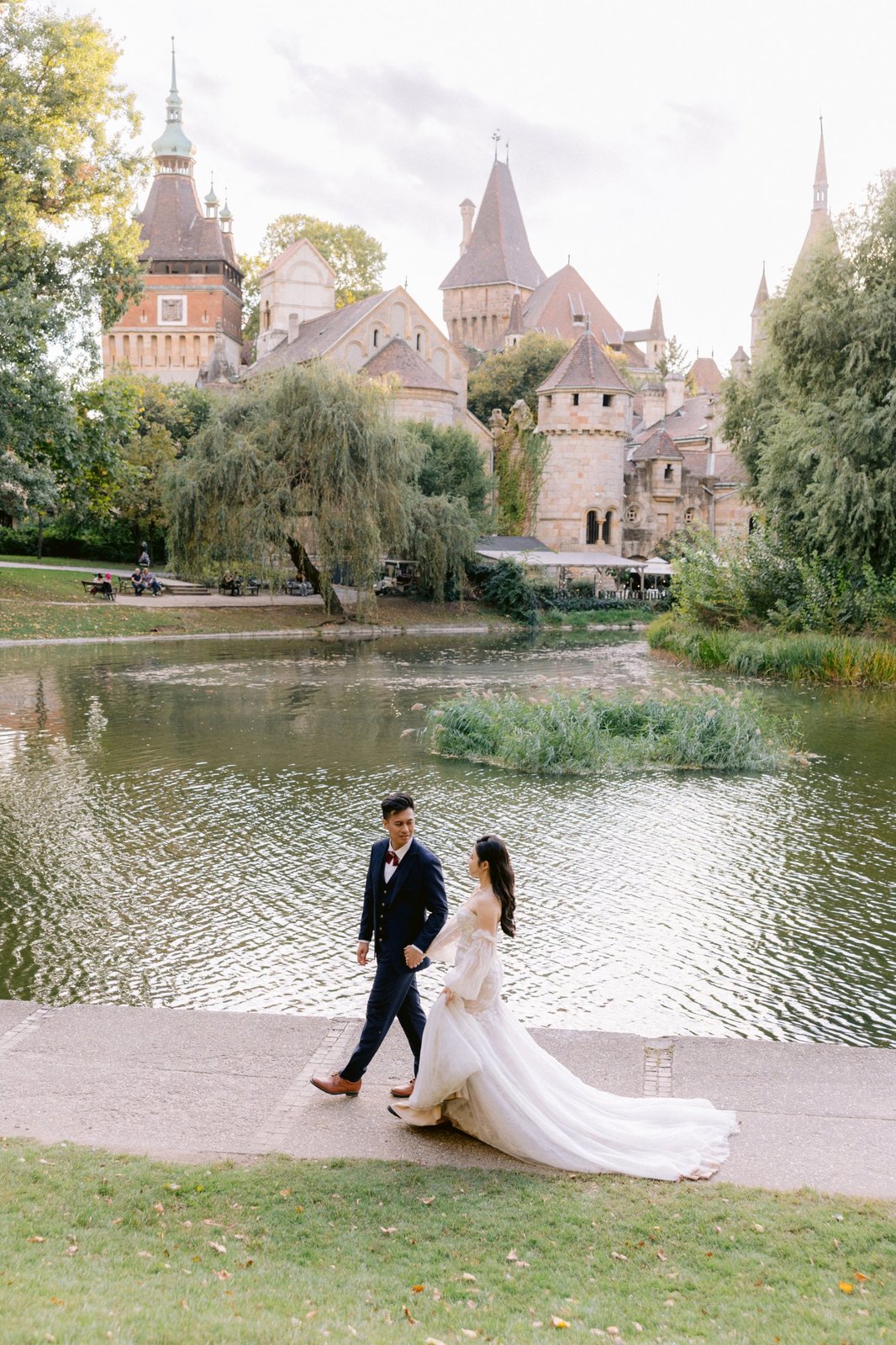 Vajdahunyad-castle-couple-walking Couple walking by Vajdahunyad Castle in Budapest