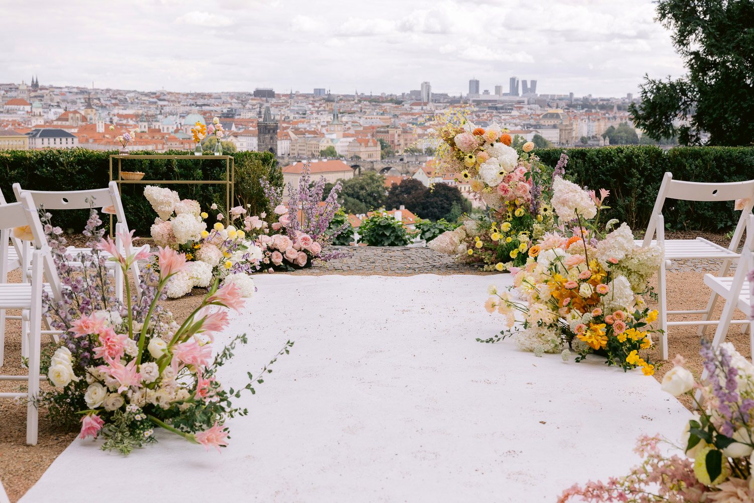 Villa Richter Ceremony Aisle Prague View Ceremony aisle lined with flowers and a view over Prague