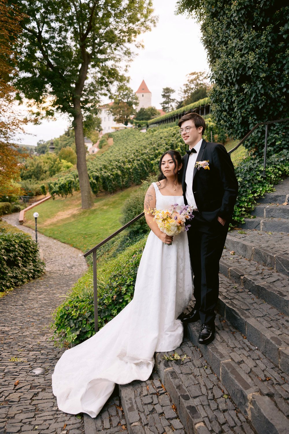 Villa Richter Couple Castle Stairs Vineyard Bride and groom on the stairs by the vineyard