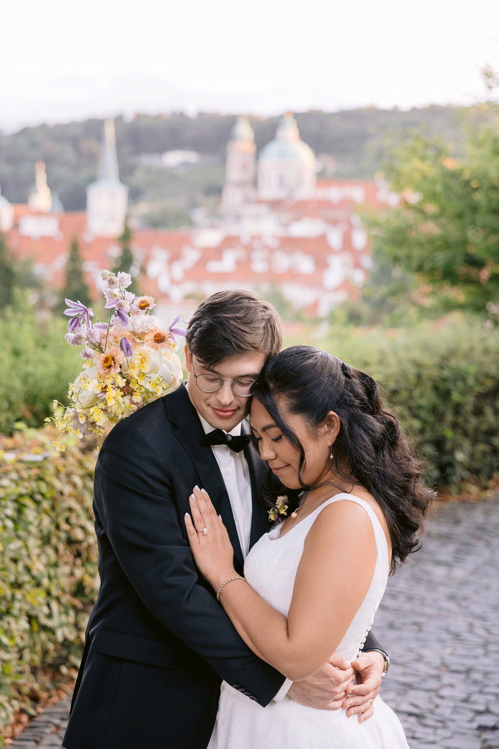 Villa Richter Couple Embrace Garden Path Bride and groom embracing on the garden path
