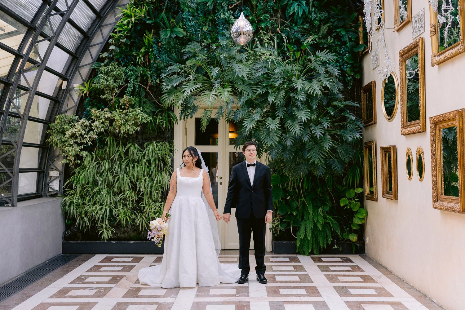 Villa Richter Couple Glasshouse Garden Hall Bride and groom walking through the glasshouse garden hall