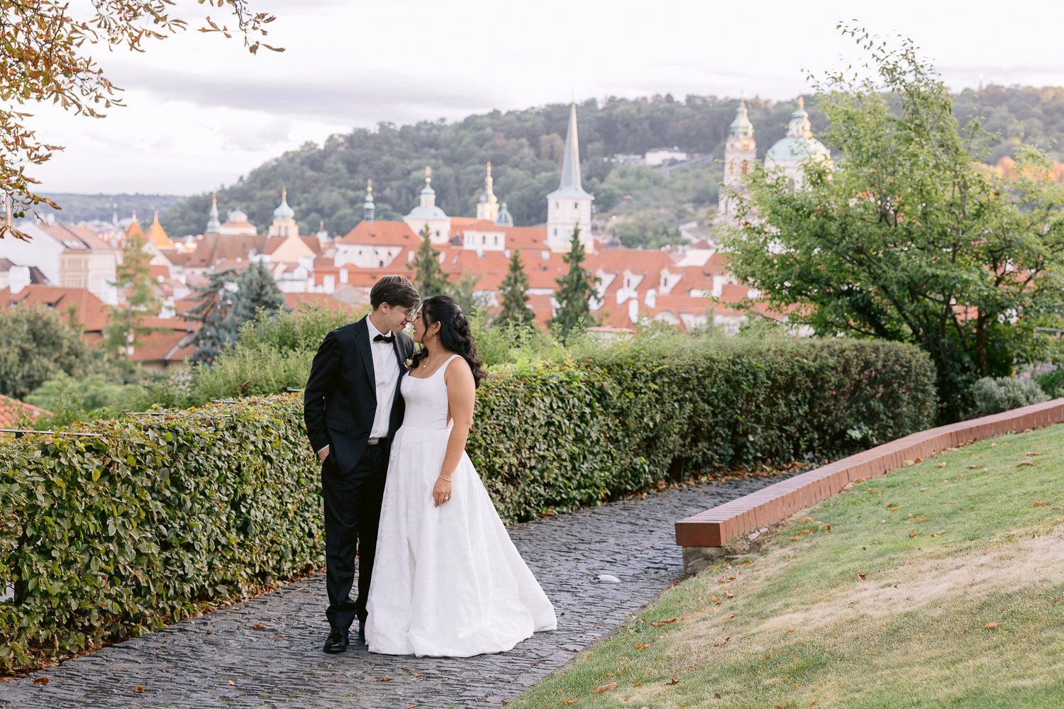 Villa Richter Couple Walking Garden Prague View Bride and groom walking through the garden above Prague