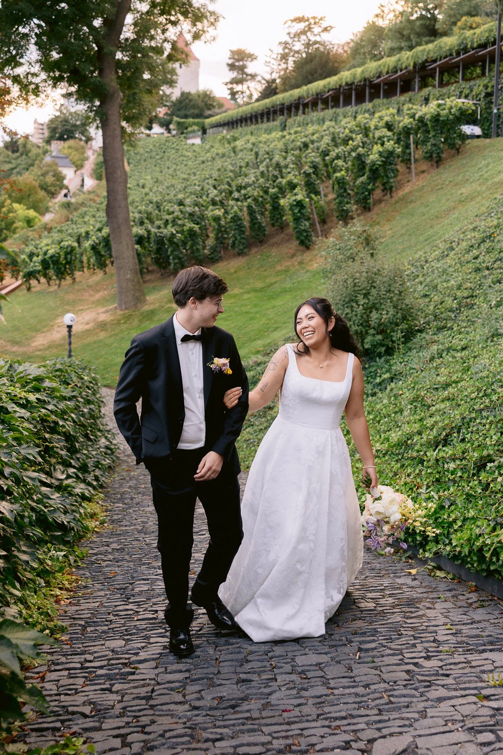 Villa Richter Couple Walking Vineyard Bride and groom walking through the St. Wenceslas Vineyard