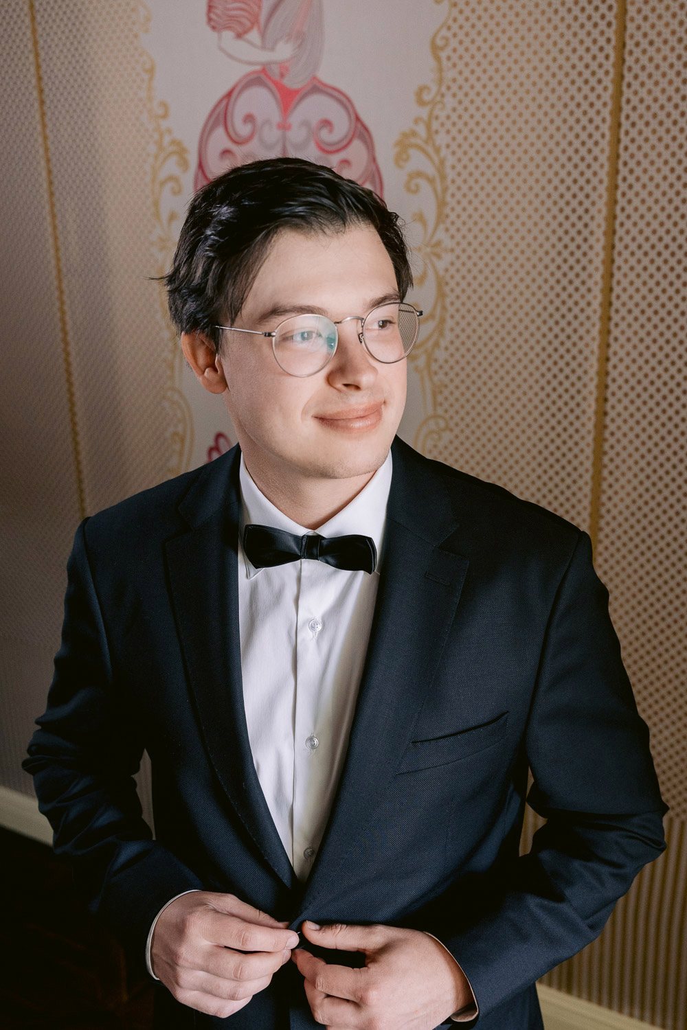 Villa Richter Groom Getting Ready Portrait Groom buttoning his jacket