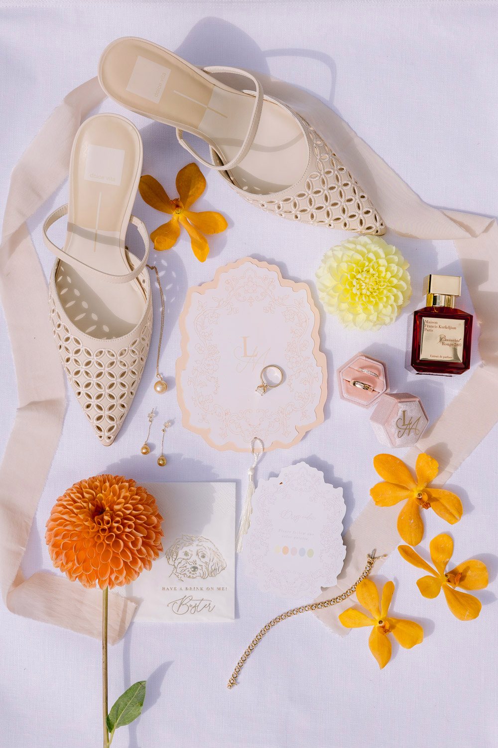 Villa Richter Wedding Details Flat Lay Wedding details with shoes, rings and orange flowers