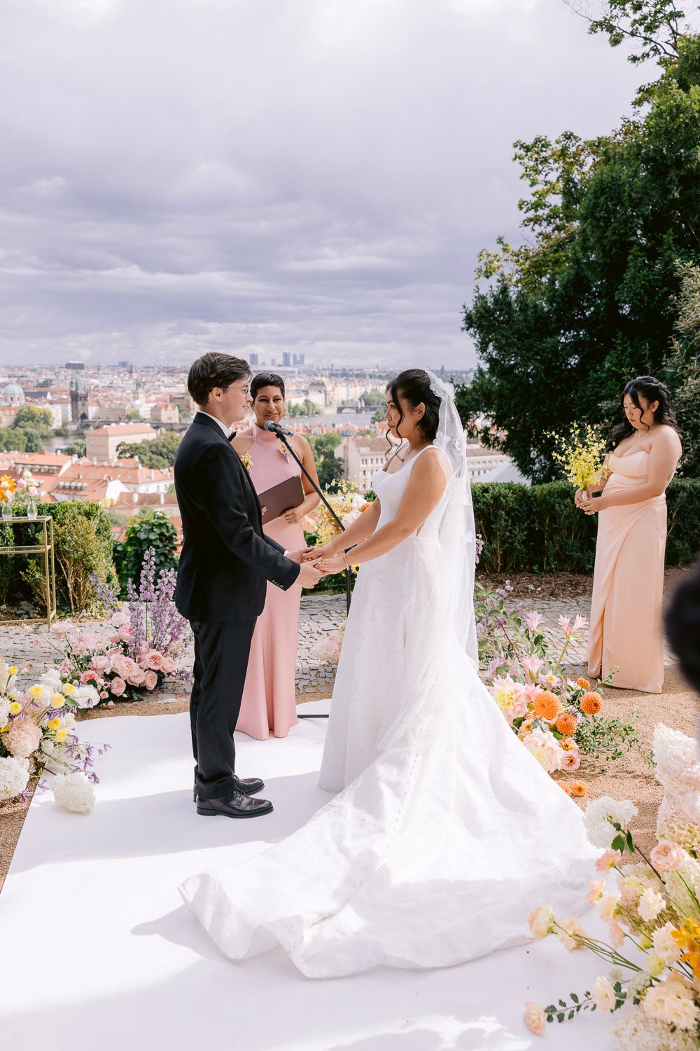 Villa Richter Wedding Vows Prague View Bride and groom exchanging vows with Prague behind them